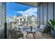 Inviting balcony with cozy seating and a view of the neighborhood at 16555 Peak Way, Broomfield, CO 80023
