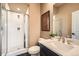 Well-lit bathroom with a glass-enclosed shower, sleek vanity, and modern fixtures at 16555 Peak Way, Broomfield, CO 80023
