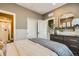 Comfortable bedroom with a neutral color palette, ample closet space, and contemporary furnishings at 16555 Peak Way, Broomfield, CO 80023