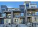Stunning new construction townhome featuring a contemporary design, private balconies, and low-maintenance landscaping at 16555 Peak Way, Broomfield, CO 80023