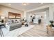 Open-concept living room showcasing a stylish kitchen and comfortable seating, perfect for entertaining at 16555 Peak Way, Broomfield, CO 80023