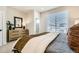 Serene main bedroom with a dresser, walk-in closet, and a bright window, offering comfort and style at 16555 Peak Way, Broomfield, CO 80023