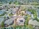 Aerial view of neighborhood with mature trees and solar panels on the roof at 7420 S Wolff St, Littleton, CO 80128