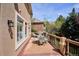 A spacious deck provides ample seating for outdoor entertaining and overlooks the yard at 7420 S Wolff St, Littleton, CO 80128