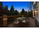 Outdoor deck with dining table and seating at 7420 S Wolff St, Littleton, CO 80128