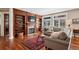 A cozy living room features built-in bookshelves, a fireplace, and hardwood floors at 7420 S Wolff St, Littleton, CO 80128