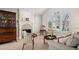 Cozy living room with fireplace, large windows, and elegant furniture at 7420 S Wolff St, Littleton, CO 80128