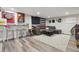 Finished basement offers a relaxed living space with a bar, seating, and stylish decor at 12023 W Virginia Ave, Lakewood, CO 80228