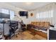 Comfortable bedroom with a desk, chair, futon, and modern television at 12023 W Virginia Ave, Lakewood, CO 80228