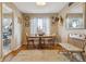 Bright dining area featuring a wooden table with seating for four, and lots of natural light at 12023 W Virginia Ave, Lakewood, CO 80228