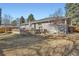 Beautiful backyard featuring a brick patio and lush green grass at 2 N Jasmine St, Denver, CO 80220