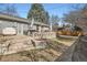 Brick backyard with brick retaining wall and lawn at 2 N Jasmine St, Denver, CO 80220