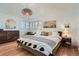 Comfortable bedroom with natural light, hardwood floors, and tasteful decor at 2 N Jasmine St, Denver, CO 80220