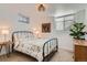 Cozy bedroom with natural light, neutral carpet, and tasteful decor at 2 N Jasmine St, Denver, CO 80220