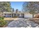 Charming single-story home with a brick facade, attached garage, and well-maintained landscaping at 2 N Jasmine St, Denver, CO 80220