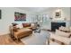 Bright living room featuring a fireplace, comfortable seating, and ample natural light at 2 N Jasmine St, Denver, CO 80220