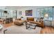 Cozy living room featuring a comfortable leather sofa, stylish decor, and ample natural light at 2 N Jasmine St, Denver, CO 80220