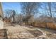 Extensive backyard brick patio with lounge seating and dining table at 2 N Jasmine St, Denver, CO 80220