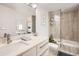 Bright bathroom featuring a modern vanity, framed glass shower and bathtub combination at 780 Walnut St # A, Boulder, CO 80302