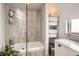 Bright bathroom features a sleek glass enclosed tub shower and built-in shelving for ample storage at 780 Walnut St # A, Boulder, CO 80302
