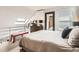 Cozy bedroom featuring an angled ceiling with skylight, minimalist decor and plenty of natural light at 780 Walnut St # A, Boulder, CO 80302
