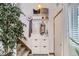 Bright entryway featuring a coat rack, bench, and decorative mirror at 780 Walnut St # A, Boulder, CO 80302