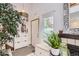 Bright entryway featuring a coat rack, bench, and decorative mirror at 780 Walnut St # A, Boulder, CO 80302