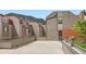 Multi-level patio with surrounding residential buildings and mountain views in the background at 780 Walnut St # A, Boulder, CO 80302