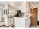 Efficient kitchen with breakfast bar, white cabinetry, and stainless steel appliances. Ready to cook at 780 Walnut St # A, Boulder, CO 80302