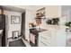 Well-lit kitchen showcases modern appliances, open shelving and stylish decor at 780 Walnut St # A, Boulder, CO 80302