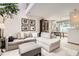 Bright and airy living room with a cozy sectional couch leading to the kitchen at 780 Walnut St # A, Boulder, CO 80302