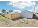 Backyard with a new fence and a detached one-car garage at 6691 Hooker St, Denver, CO 80221