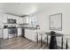 Modern kitchen featuring stainless steel appliances, granite countertops, and a breakfast nook, perfect for everyday living at 6691 Hooker St, Denver, CO 80221