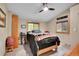 Comfortable bedroom with a sloped ceiling, natural wood bed frame, and serene natural light at 11182 S Barney Gulch Rd, Conifer, CO 80433