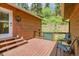 Wooden deck with seating area, offering an inviting outdoor space with access to backyard at 11182 S Barney Gulch Rd, Conifer, CO 80433