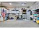 Well-lit garage with built-in cabinets and shelving, providing ample storage and workspace at 11182 S Barney Gulch Rd, Conifer, CO 80433
