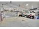 Spacious garage with ample storage, an ATV, and plenty of room for parking or projects at 11182 S Barney Gulch Rd, Conifer, CO 80433