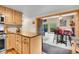 Open concept kitchen with wooden cabinets, granite countertop island and dining area at 11182 S Barney Gulch Rd, Conifer, CO 80433