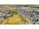 Community aerial view with green spaces, playgrounds, and well-maintained roads at 17767 E 54Th Ave, Denver, CO 80249