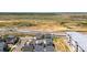 Extensive aerial view showcasing the neighborhood's proximity to open fields and roadways at 17767 E 54Th Ave, Denver, CO 80249