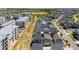 Aerial view showcasing the community layout with a mix of apartments and single-Gathering homes at 17767 E 54Th Ave, Denver, CO 80249