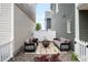 Cozy back patio equipped with modern fire pit and comfortable seating, creating an ideal retreat at 17767 E 54Th Ave, Denver, CO 80249