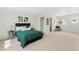 Serene main bedroom with a plush bed, soft carpeting, and a walk-in closet, creating a restful retreat at 17767 E 54Th Ave, Denver, CO 80249