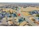 Aerial view of the home showcasing proximity to neighborhood streets and outdoor living spaces at 3406 Purcell St, Brighton, CO 80601