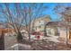 Scenic backyard view featuring a patio, garden shed, firepit, and lush landscaping at 3406 Purcell St, Brighton, CO 80601