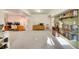Spacious basement area with a computer desk, bookshelves, a refrigerator, and ample storage at 3406 Purcell St, Brighton, CO 80601