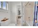 Cozy bathroom featuring a tiled shower-tub, a toilet, and a small cabinet beside the toilet at 3406 Purcell St, Brighton, CO 80601