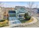 Charming two-story home featuring a welcoming front porch, attached garage, and well-maintained landscaping at 3406 Purcell St, Brighton, CO 80601