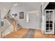 Bright foyer with hardwood floors, staircase, and elegant front door at 3406 Purcell St, Brighton, CO 80601