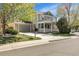 Charming two-story home with a stone-accented garage, inviting front porch, and a well-manicured lawn at 3406 Purcell St, Brighton, CO 80601